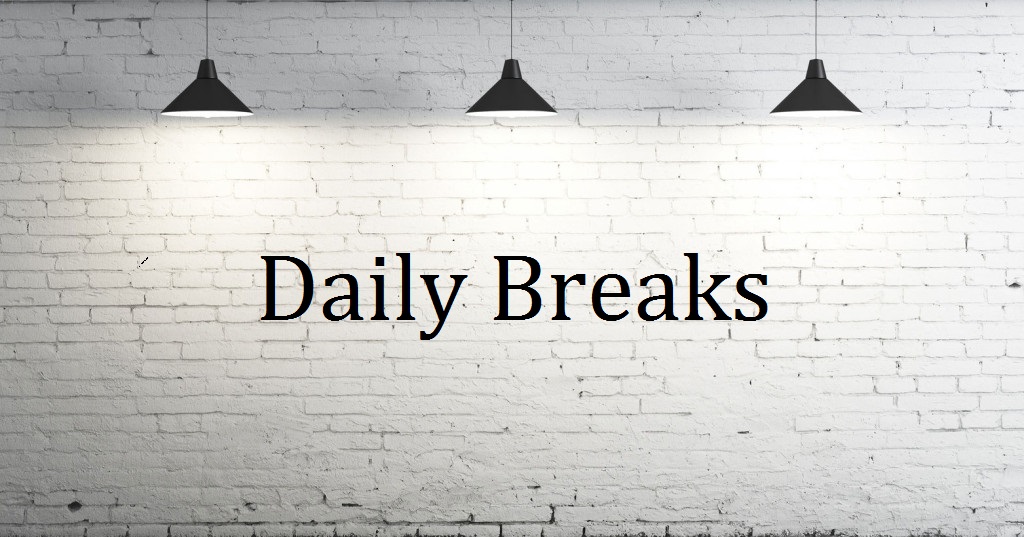 picture of a white wall with 3 lights and the word Daily break written on the wall