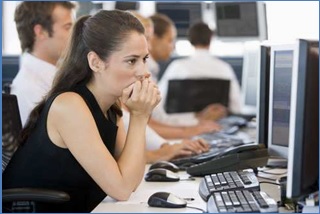 woman in front of computer thinking
